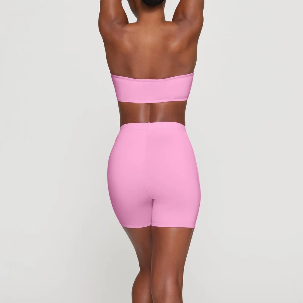 NWT SKIMS RECYCLED SWIM MID WAIST SHORT IN LIGHT PINK SIZE XS